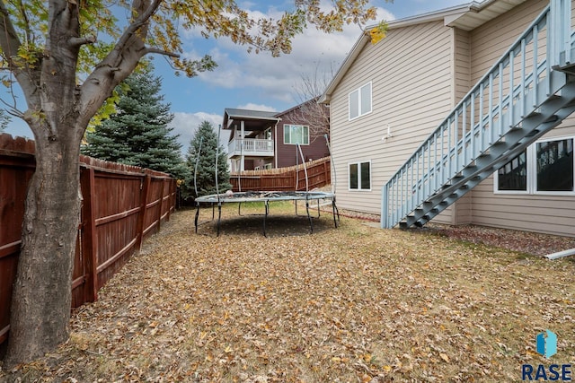 view of yard with a trampoline