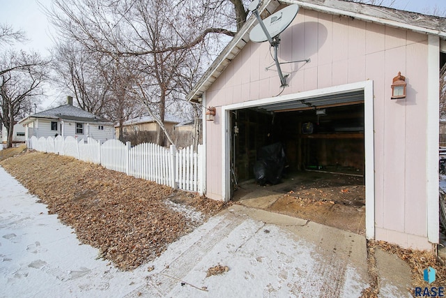 view of snow covered garage