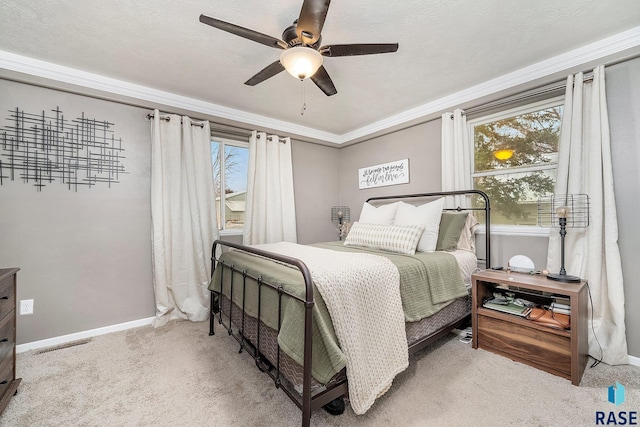 bedroom featuring ceiling fan, light carpet, and ornamental molding