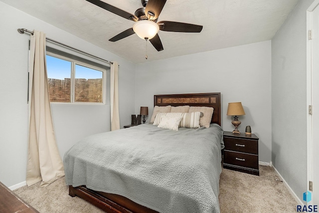 bedroom with light colored carpet and ceiling fan