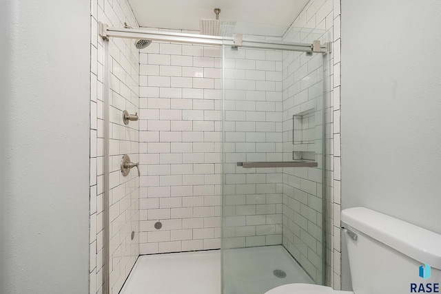 bathroom with toilet and walk in shower