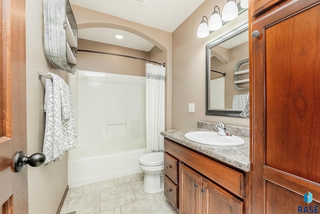 full bathroom with tile patterned floors, vanity, toilet, and shower / bath combo with shower curtain