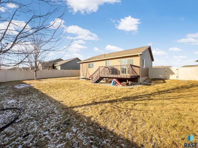 back of house with a lawn and a wooden deck