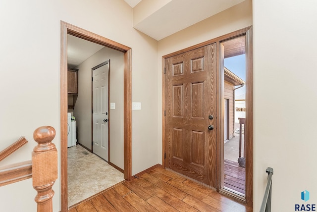 foyer entrance featuring washer / clothes dryer