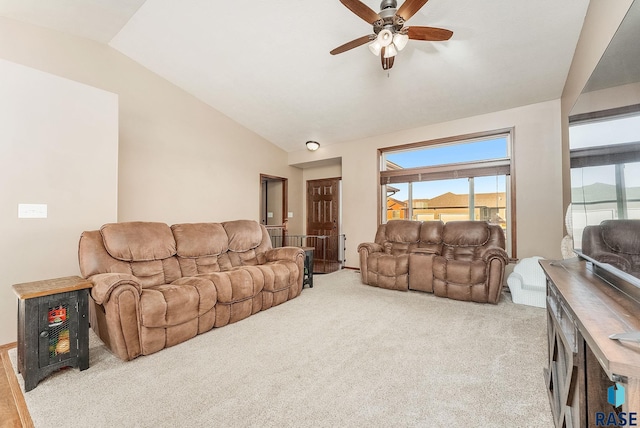 living room with light carpet, ceiling fan, and lofted ceiling