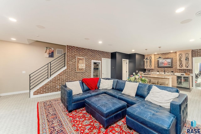 living area featuring visible vents, wine cooler, stairway, and recessed lighting