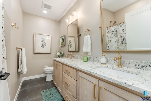 full bath with baseboards, tile patterned flooring, visible vents, and a sink