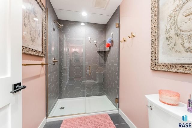 full bathroom with tile patterned flooring, toilet, visible vents, baseboards, and a stall shower