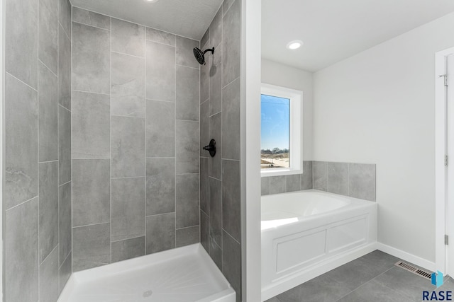 bathroom with plus walk in shower and tile patterned floors