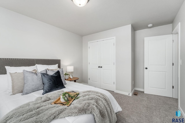 bedroom with carpet floors and a closet