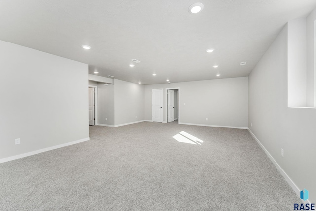 spare room with light colored carpet