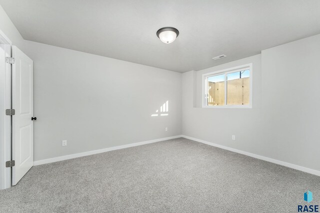 unfurnished room with carpet floors