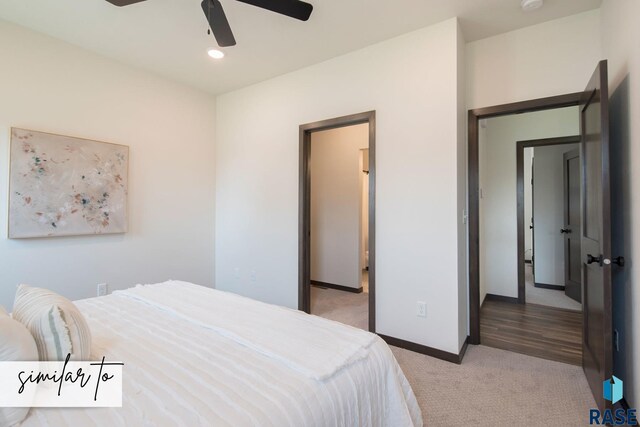 carpeted bedroom with ceiling fan