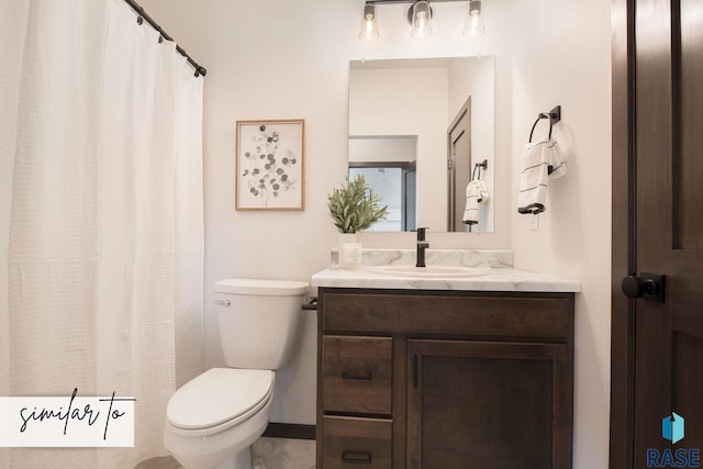 bathroom with toilet and vanity