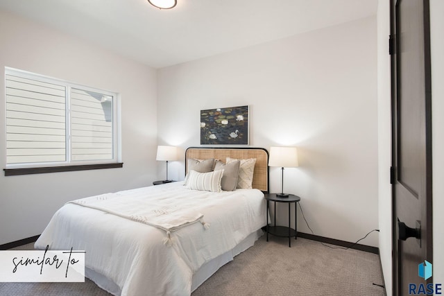 bedroom featuring light colored carpet