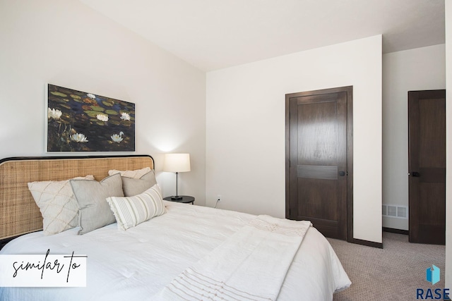 bedroom featuring light carpet