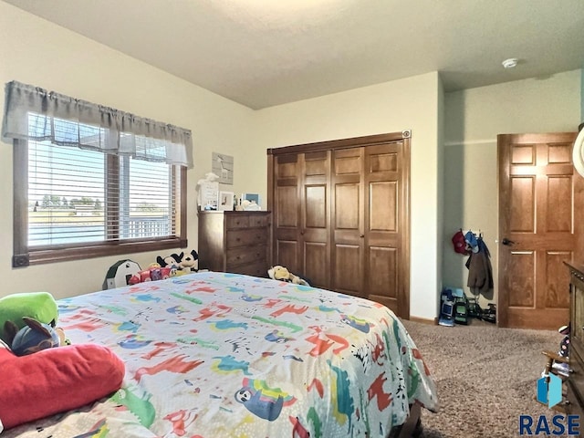 carpeted bedroom with a closet