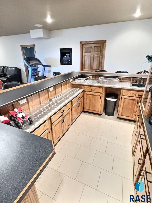 kitchen featuring sink and light tile patterned floors