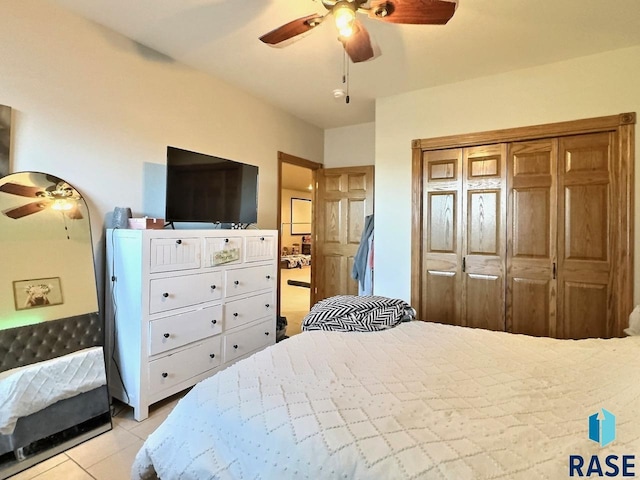 tiled bedroom with ceiling fan