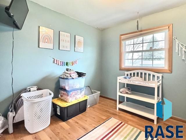 playroom with hardwood / wood-style flooring