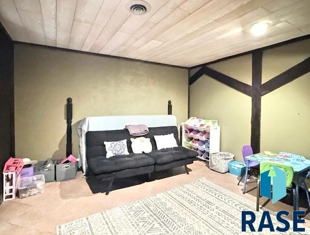 playroom with wooden ceiling