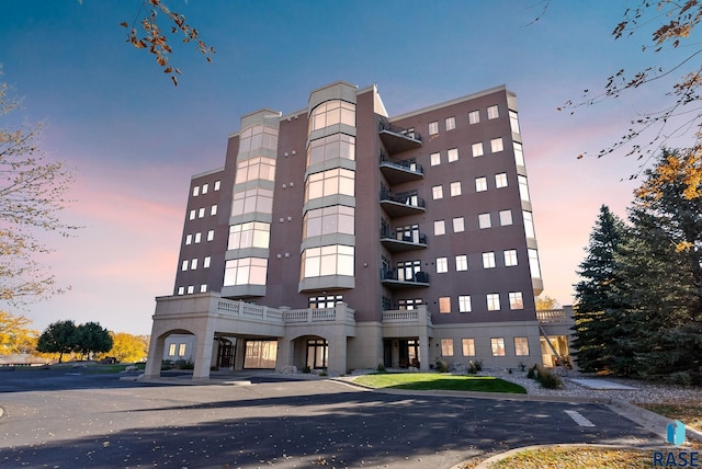 view of outdoor building at dusk