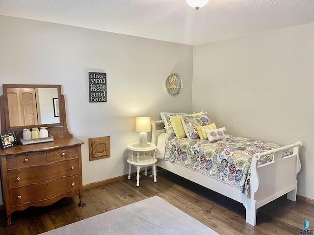 bedroom featuring dark wood-type flooring