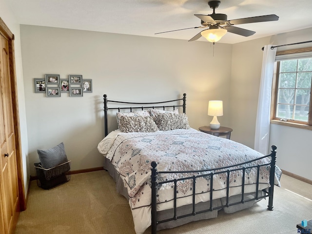 bedroom with ceiling fan, a closet, and carpet floors