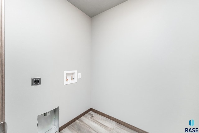 laundry room featuring hookup for an electric dryer, hookup for a washing machine, and light wood-type flooring