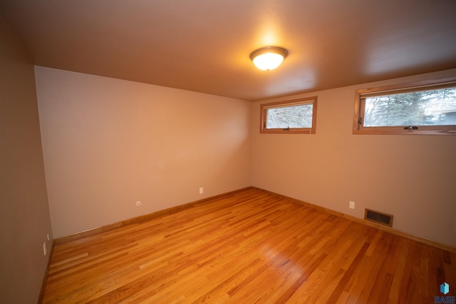 unfurnished room featuring light wood-type flooring