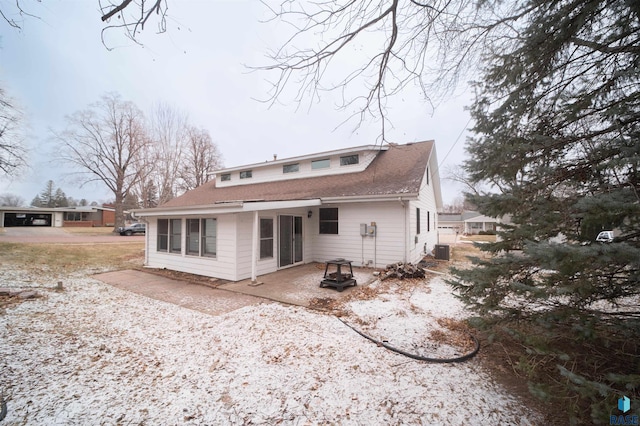 rear view of property with a patio area and central air condition unit