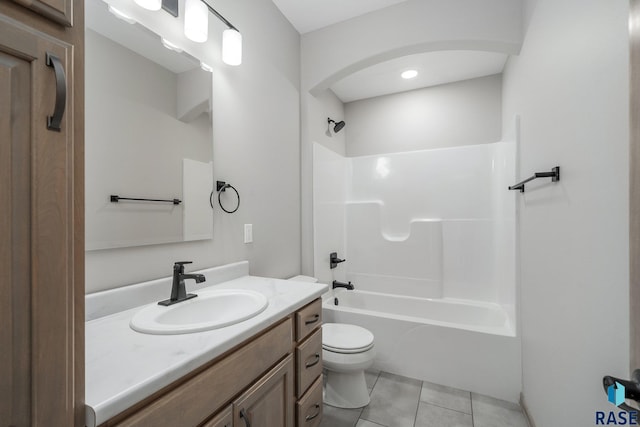 full bathroom with tile patterned floors, vanity, bathtub / shower combination, and toilet