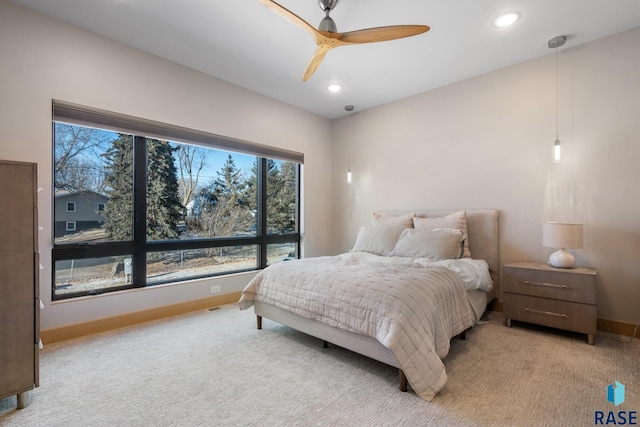 bedroom with a ceiling fan, recessed lighting, light carpet, and baseboards