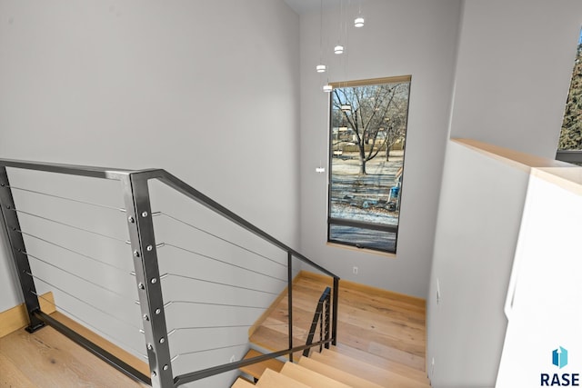 stairway with wood finished floors