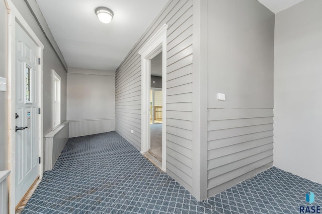 hallway featuring ornamental molding