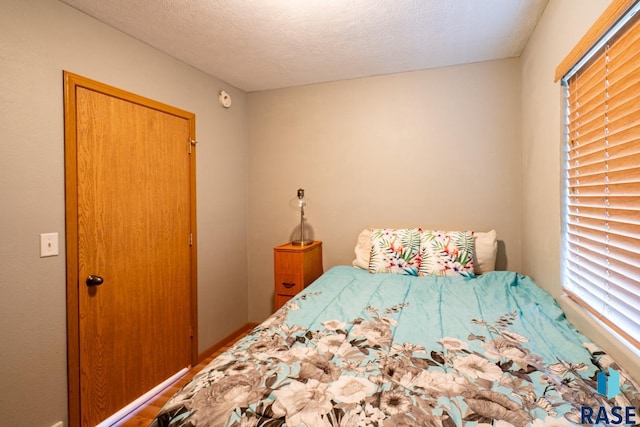 unfurnished bedroom featuring a textured ceiling