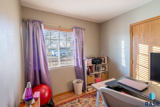 office area with light hardwood / wood-style flooring