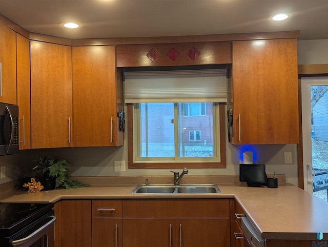 kitchen featuring sink and black appliances