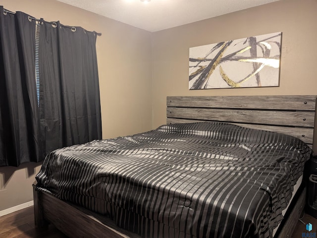 bedroom featuring dark wood-type flooring