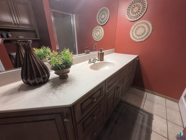 bathroom with tile patterned flooring and vanity