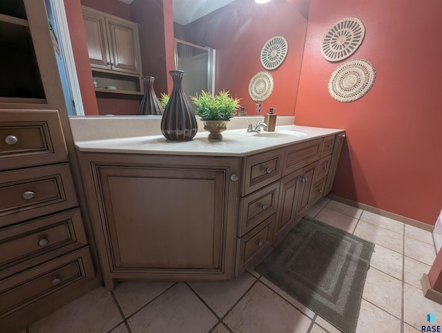 bathroom with tile patterned flooring and vanity