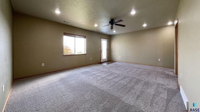 carpeted empty room with ceiling fan