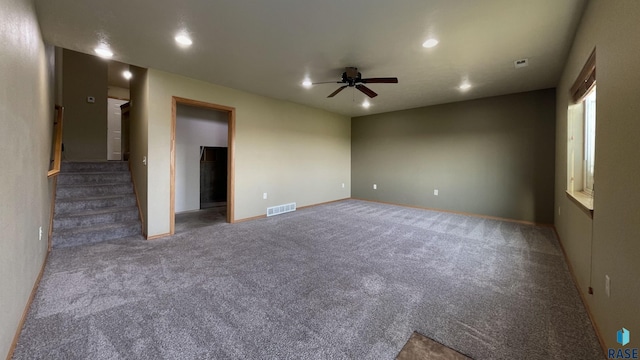 unfurnished room with carpet floors and ceiling fan