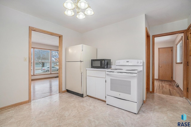 kitchen with white cabinets, white appliances, and a notable chandelier