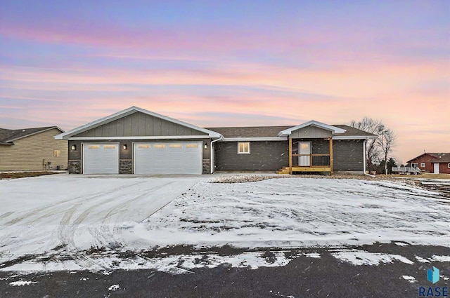 ranch-style home featuring a garage