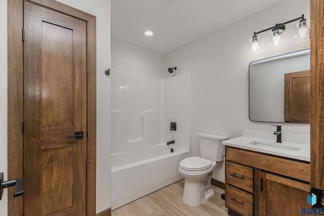 full bathroom featuring shower / bathing tub combination, vanity, toilet, and wood-type flooring