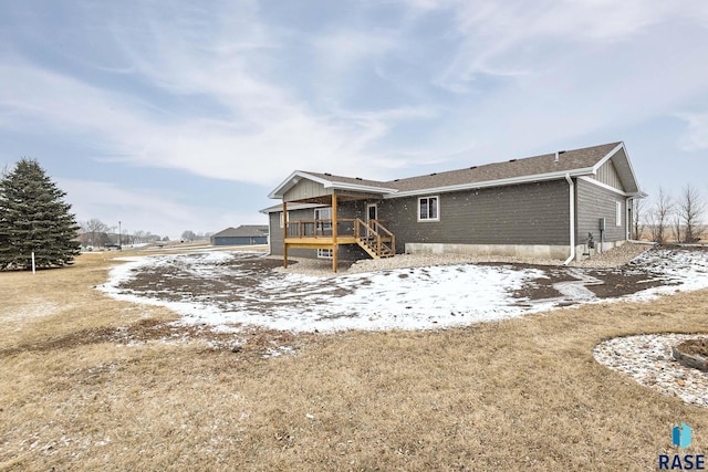 rear view of house with a wooden deck