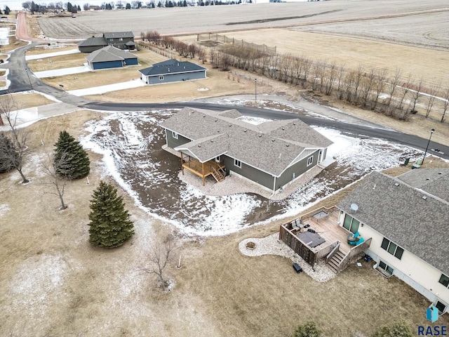 birds eye view of property with a rural view