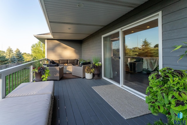 wooden terrace featuring an outdoor hangout area