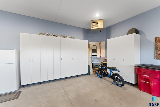 garage with white fridge